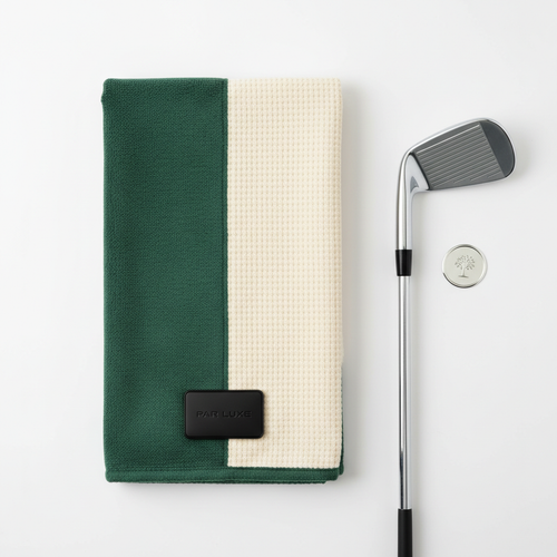 Magnetic Tour Towel flat lay with golf club and ball marker